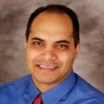 Dr. Corey K. Karimjee