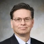 Dr. Earl John Glusac, MD