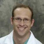 Dr. Garrick A. Cox, MD
