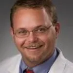 Dr. Justin N. Baker, MD