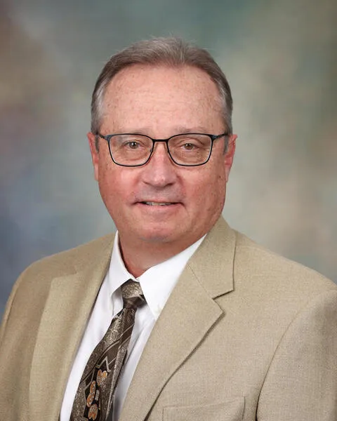 Dr. Mark K. Lyons, MD