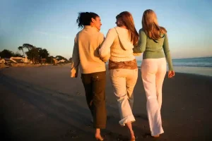 women walking on the beach